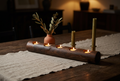Rustic wood log tea light holder on a dining table