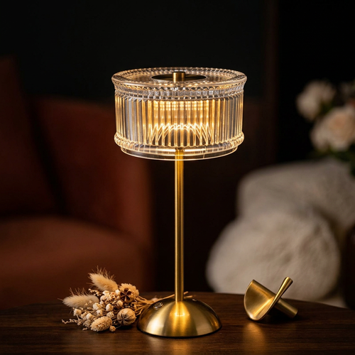 Crystal-look cordless table lamp close-up with gold base and dried florals