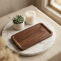 Dark walnut-tone solid wood catchall tray on a nightstand