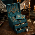 Open vintage green 3-layer jewelry box with necklaces, rings and earrings inside